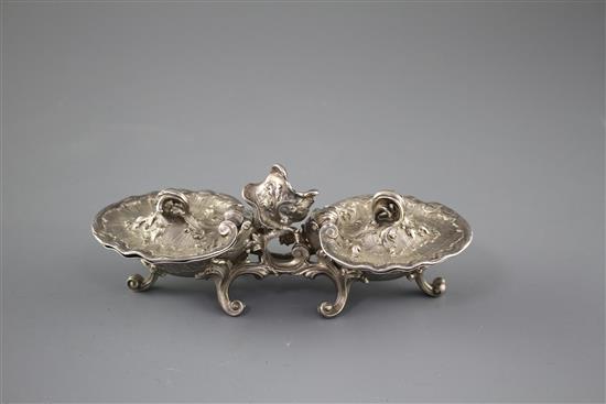 An 18th century French rococco white metal double salt, with hinged covers, on scrolling feet, marks quite rubbed, 18.3cm, 12.5oz,